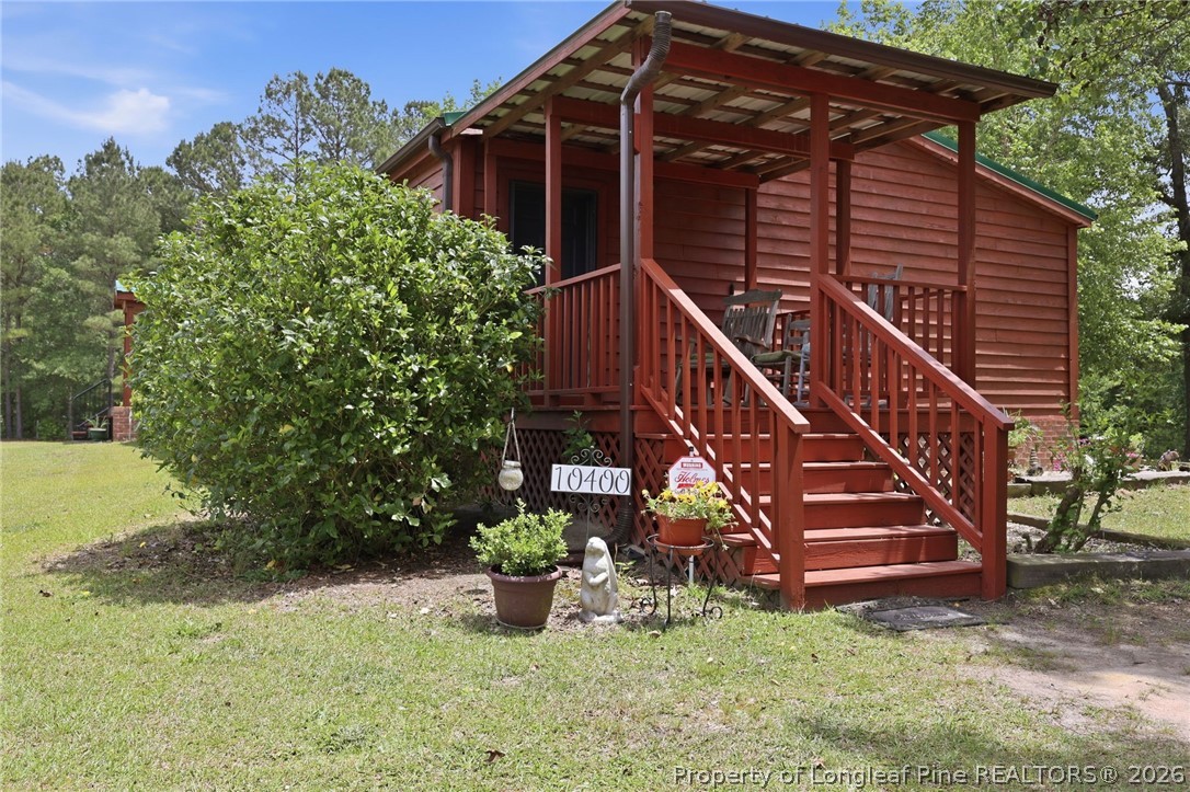 10400 Ruth Vinson Road Autryville, NC 28318 - Photo 16 of 49 a view of a house with a yard