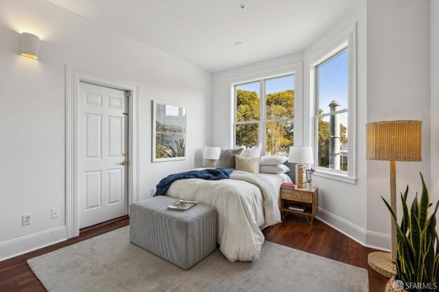 a bed room with a bed and a window