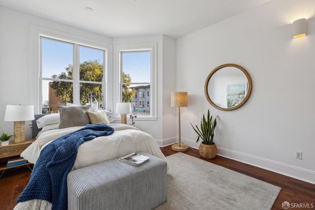a bedroom with bed and a window
