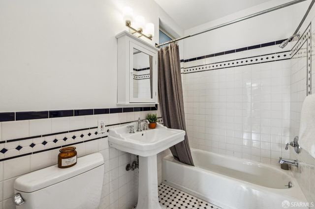 a bathroom with a sink a bath tub and a shower