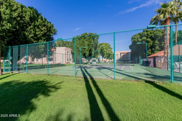a view of a backyard with swimming pool