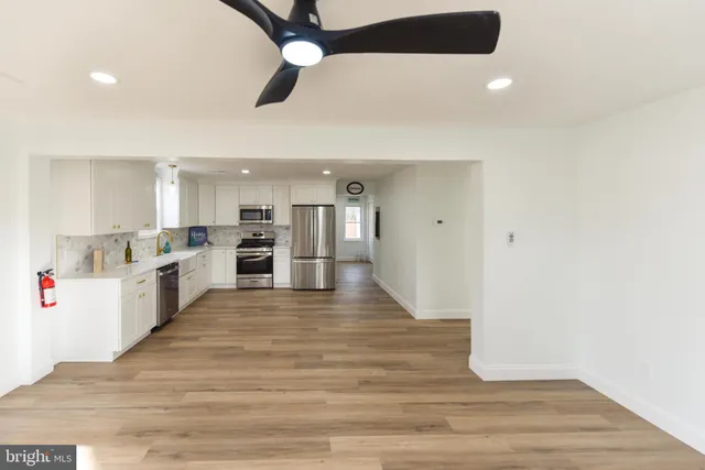 a view of kitchen with wooden floor