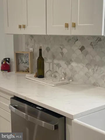 a close view of sink and cabinets