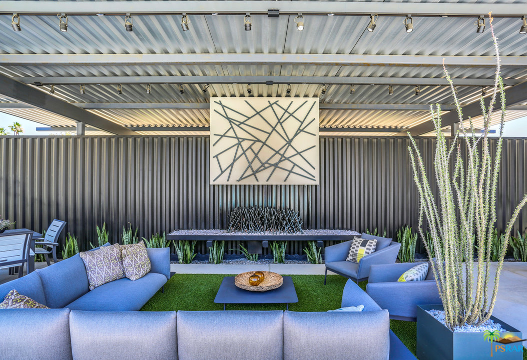 161 The Riv Palm Springs, CA 92262 - Photo 12 of 15 a living room with patio furniture and a potted plant