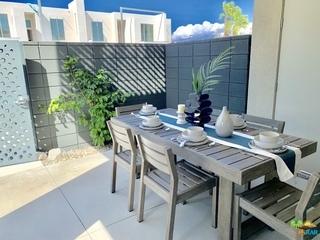 161 The Riv Palm Springs, CA 92262 - Photo 14 of 15 a view of a patio with table and chairs