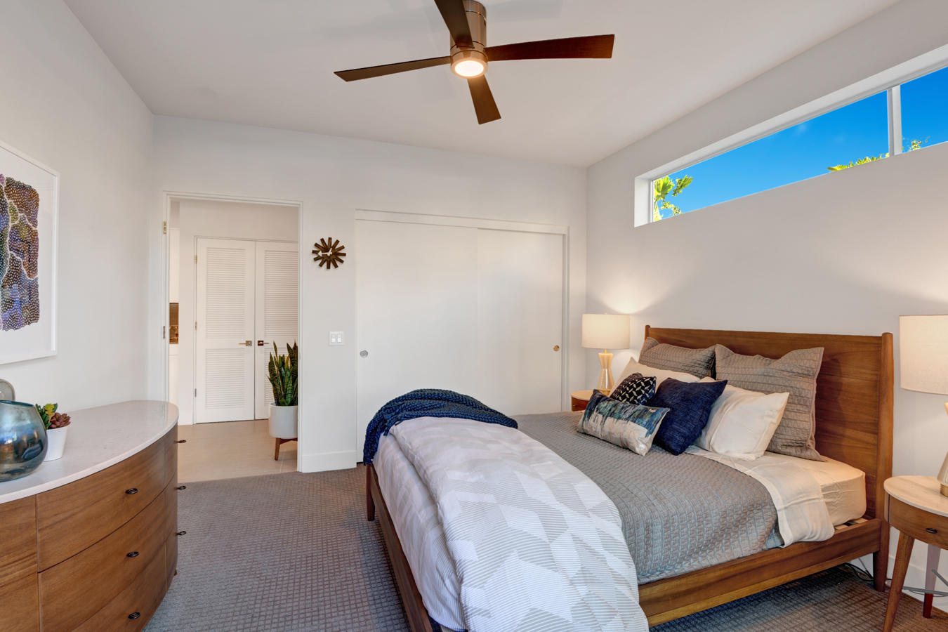 161 The Riv Palm Springs, CA 92262 - Photo 5 of 15 a bedroom with a bed and a chandelier