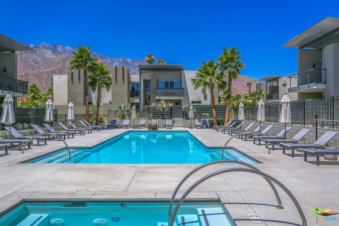 161 The Riv Palm Springs, CA 92262 - Photo 10 of 15 a swimming pool with outdoor seating and yard