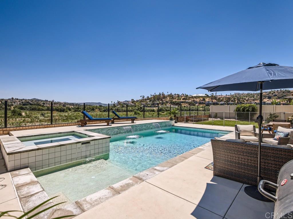 31657 Calle De Las Estrellas Bonsall, CA 92003 - Photo 1 of 24 a view of a swimming pool with a lounge chairs