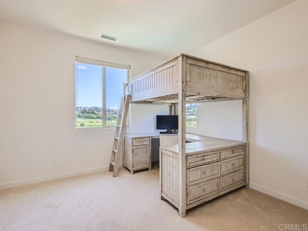 31657 Calle De Las Estrellas Bonsall, CA 92003 - Photo 20 of 24 a kitchen with cabinets and steel stainless steel appliances