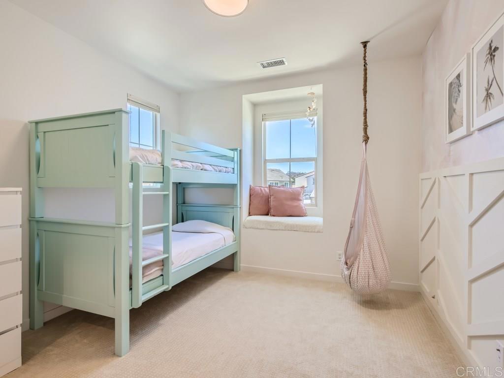 31657 Calle De Las Estrellas Bonsall, CA 92003 - Photo 21 of 24 a bedroom with a bed and a window