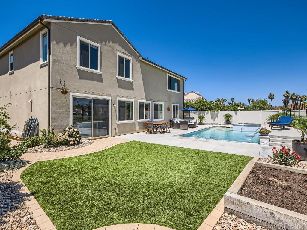 31657 Calle De Las Estrellas Bonsall, CA 92003 - Photo 7 of 24 a swimming pool with outdoor seating and yard