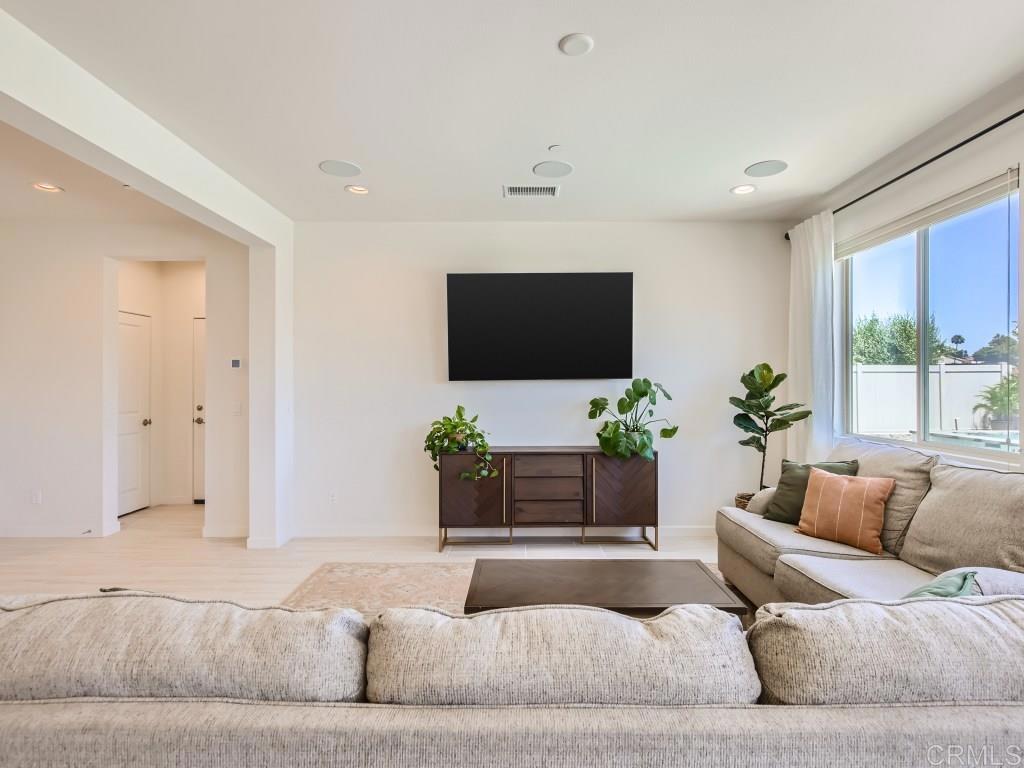 31657 Calle De Las Estrellas Bonsall, CA 92003 - Photo 10 of 24 a living room with furniture and a flat screen tv