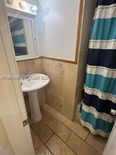 9225 Southwest 87th Avenue, Unit A6 Miami, FL 33176 - Photo 12 of 16 a bathroom with a sink and a mirror