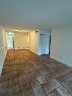 9225 Southwest 87th Avenue, Unit A6 Miami, FL 33176 - Photo 5 of 16 a view of an empty room and window