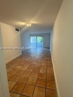 9225 Southwest 87th Avenue, Unit A6 Miami, FL 33176 - Photo 10 of 16 a view of a hallway with wooden floor