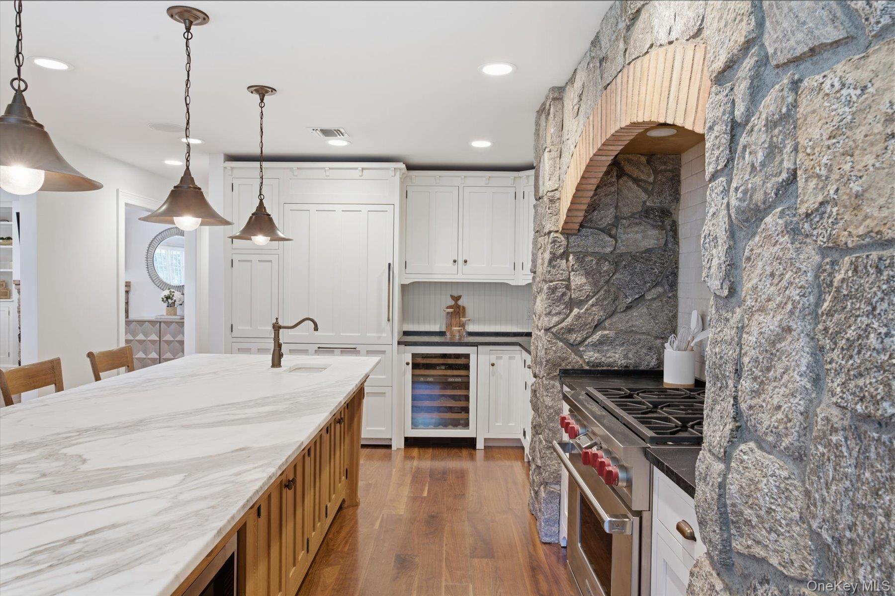 134 Sandy Hollow Road Northport, NY 11768 - Photo 5 of 28 Oversized Calcutta marble island with prep sink great for entertaining