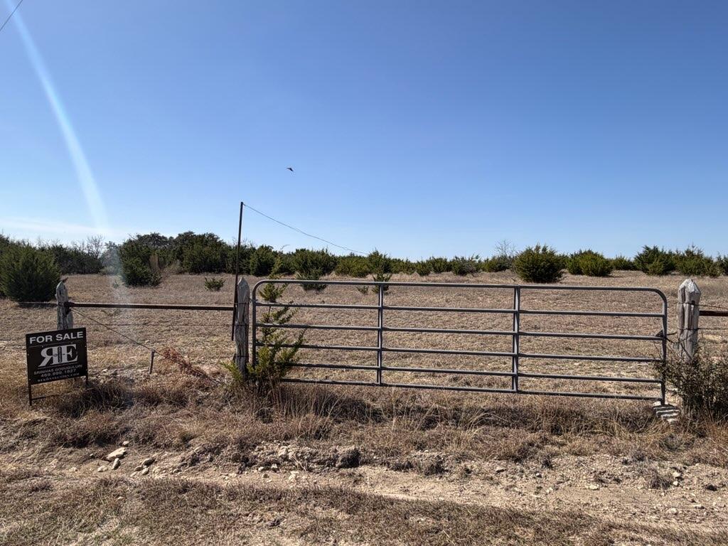 180 Nordic Ridge Road Bertram, TX 78605 - Photo 8 of 12 Gate featuring a rural view