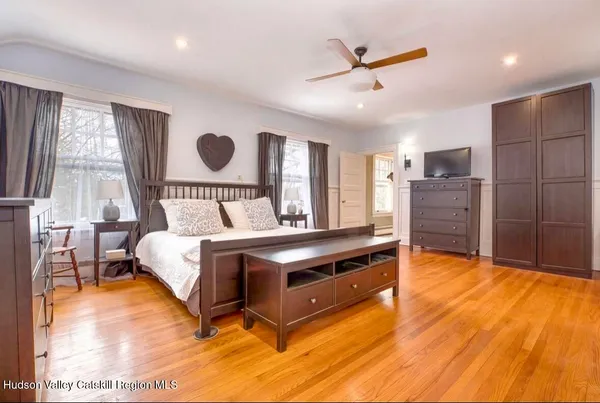 a bedroom with a bed and window