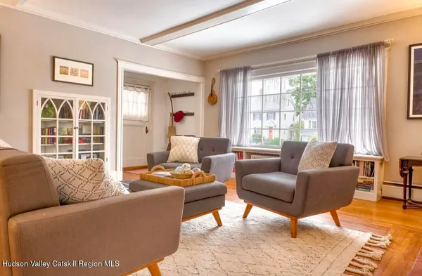 a living room with furniture and windows