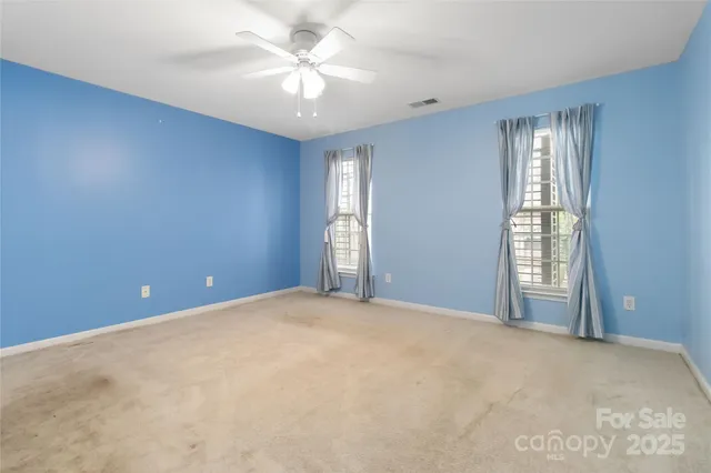 a bathroom with a sink vanity and a mirror