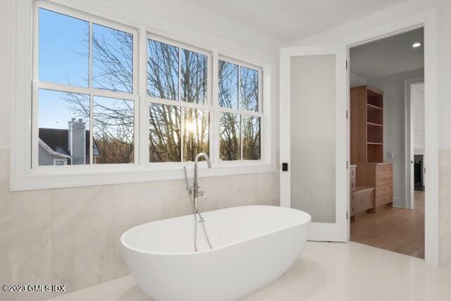 204 Sheep Hill Road Riverside, CT 06878 - Photo 32 of 62 a white bath tub sitting next to a window