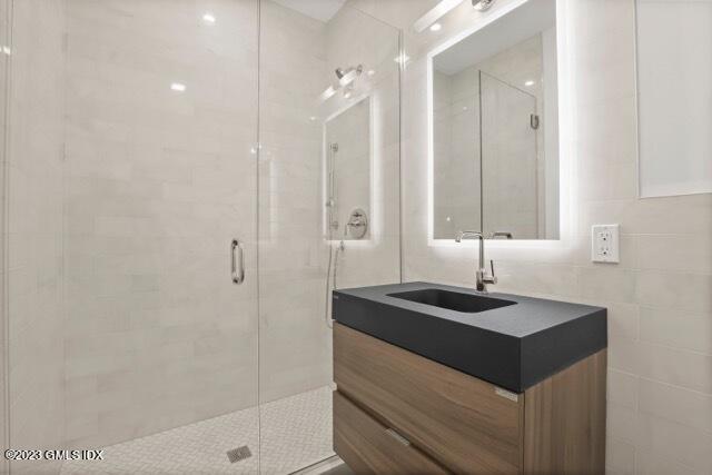 204 Sheep Hill Road Riverside, CT 06878 - Photo 41 of 62 a bathroom with a sink and a mirror