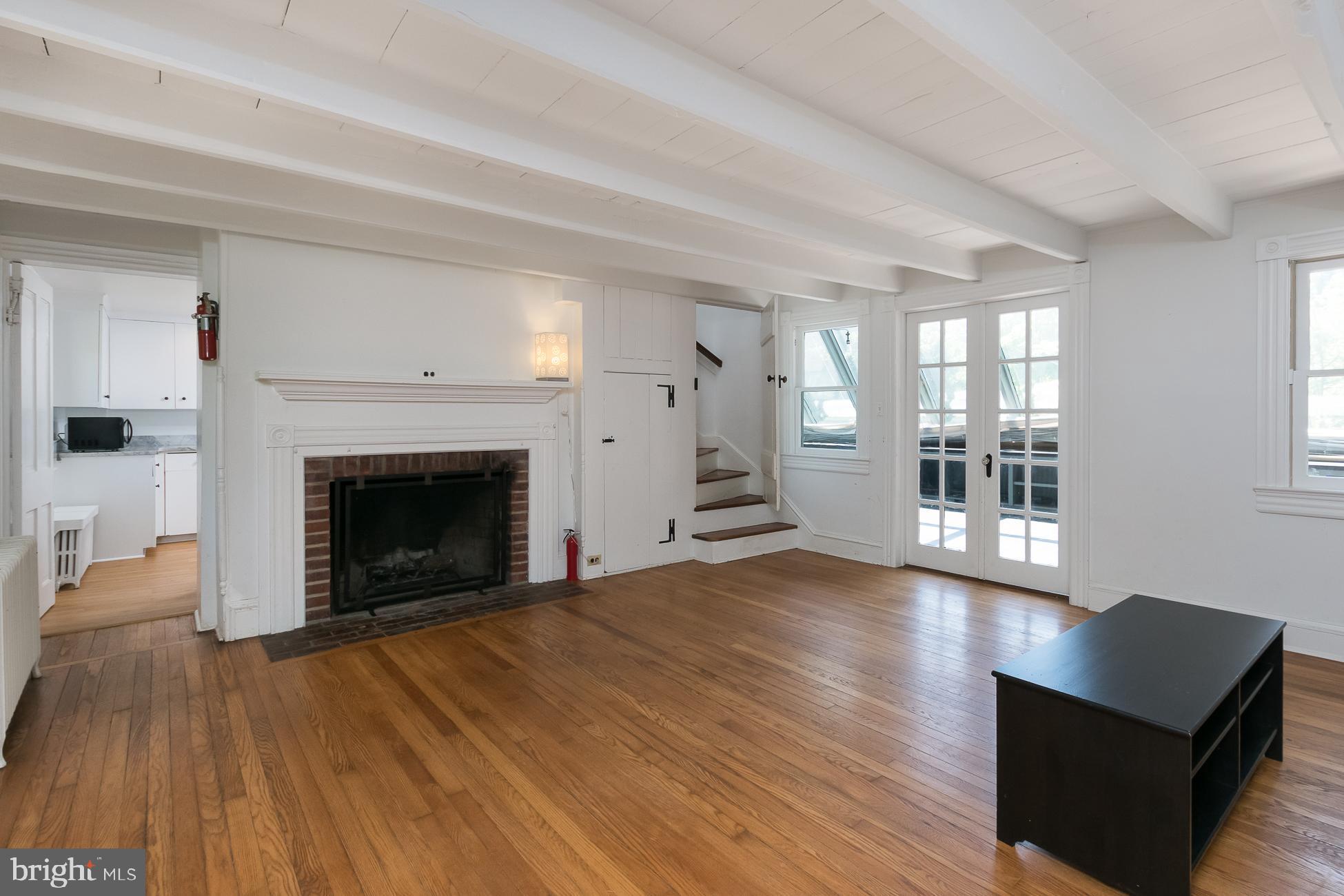 146 Carter Road Princeton, NJ 08540 - Photo 11 of 39 a view of a livingroom with wooden floor and a fireplace