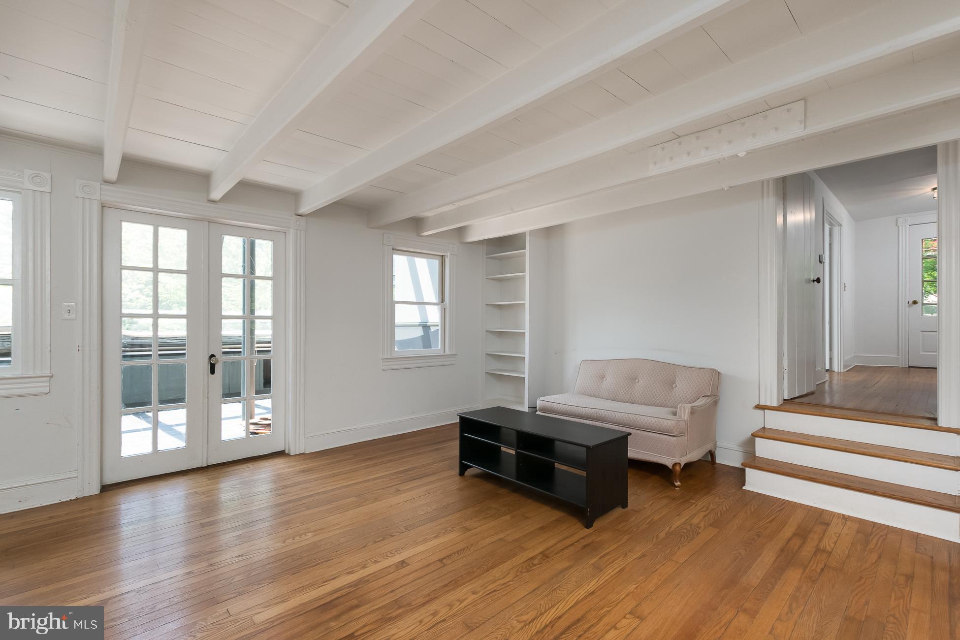 146 Carter Road Princeton, NJ 08540 - Photo 13 of 39 a living room with furniture and a floor to ceiling window