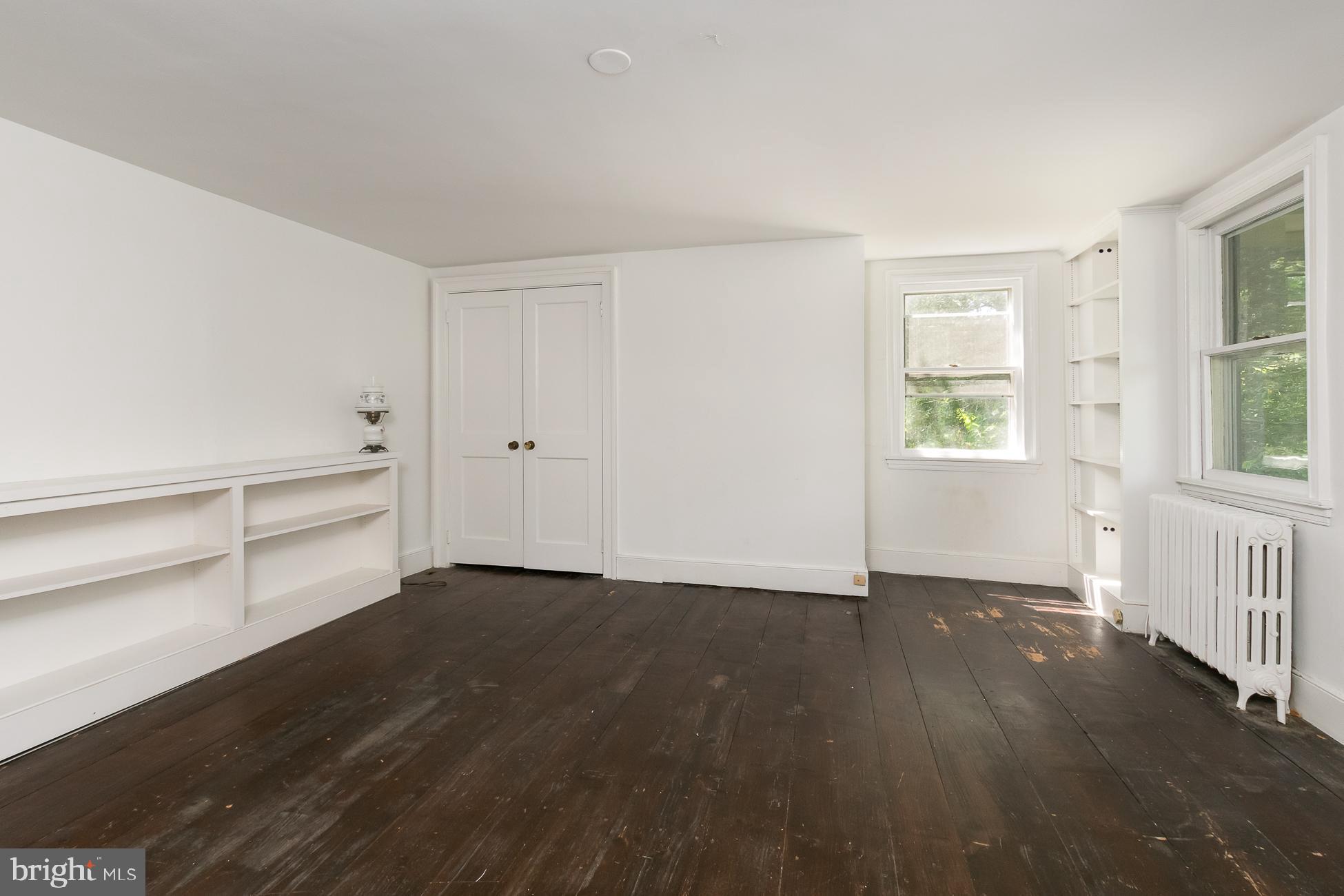 146 Carter Road Princeton, NJ 08540 - Photo 15 of 39 an empty room with wooden floor and windows