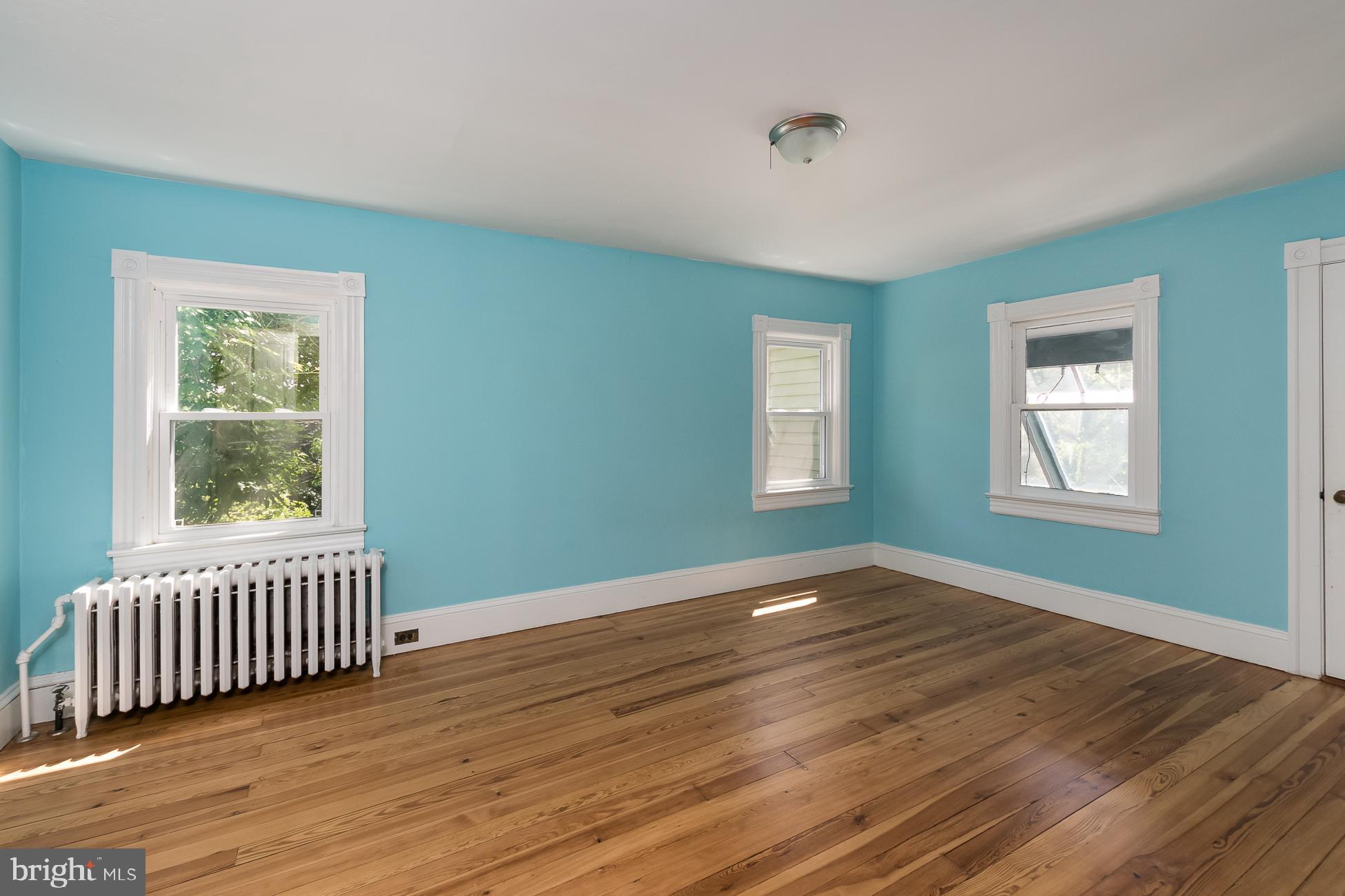 146 Carter Road Princeton, NJ 08540 - Photo 20 of 39 a view of an empty room with window and wooden floor