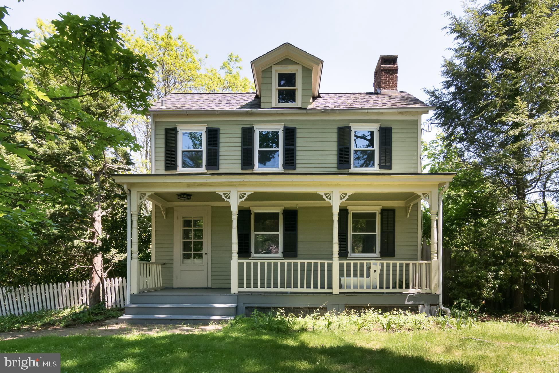 146 Carter Road Princeton, NJ 08540 - Photo 3 of 39 a front view of a house with a garden
