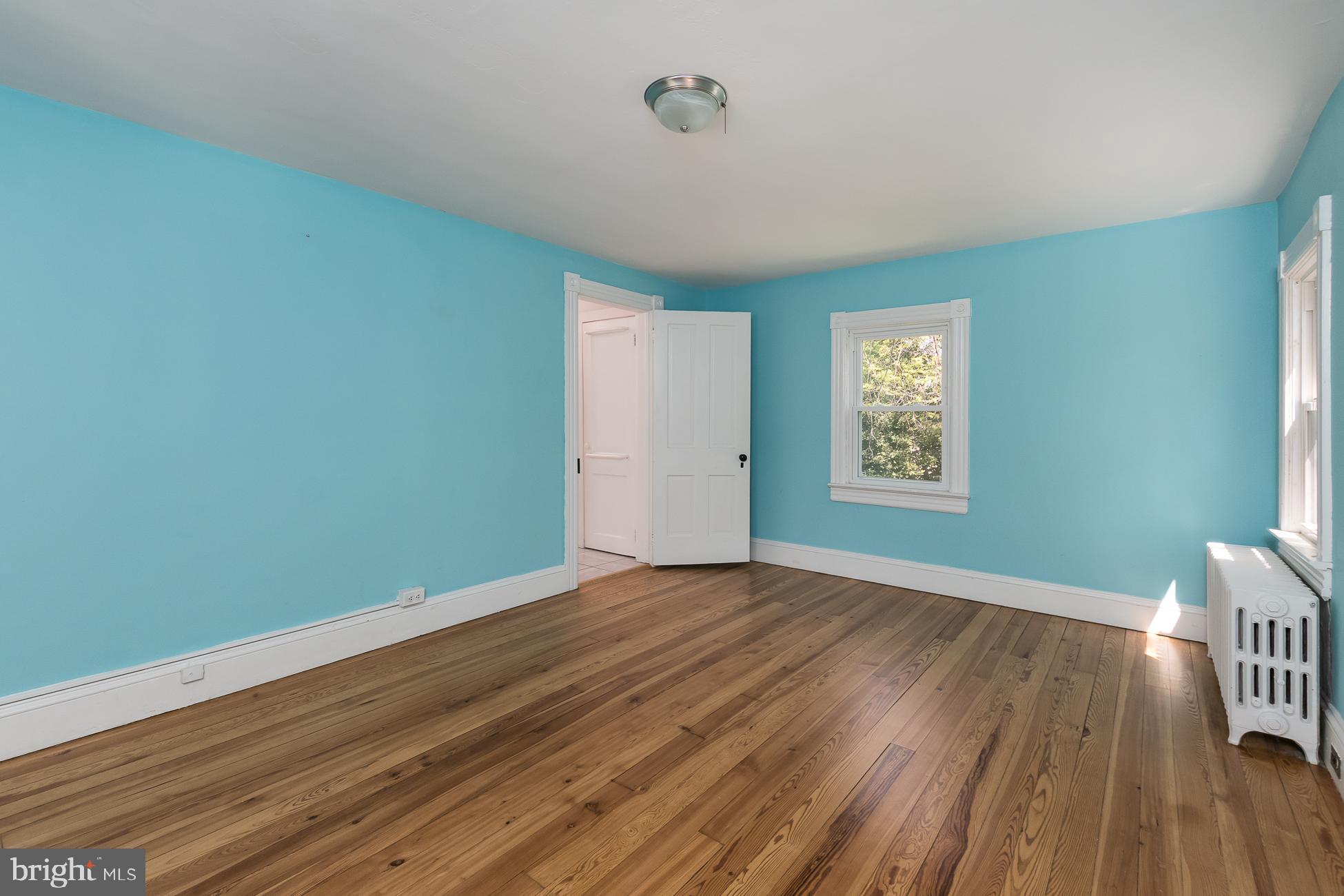 146 Carter Road Princeton, NJ 08540 - Photo 21 of 39 an empty room with wooden floor and windows
