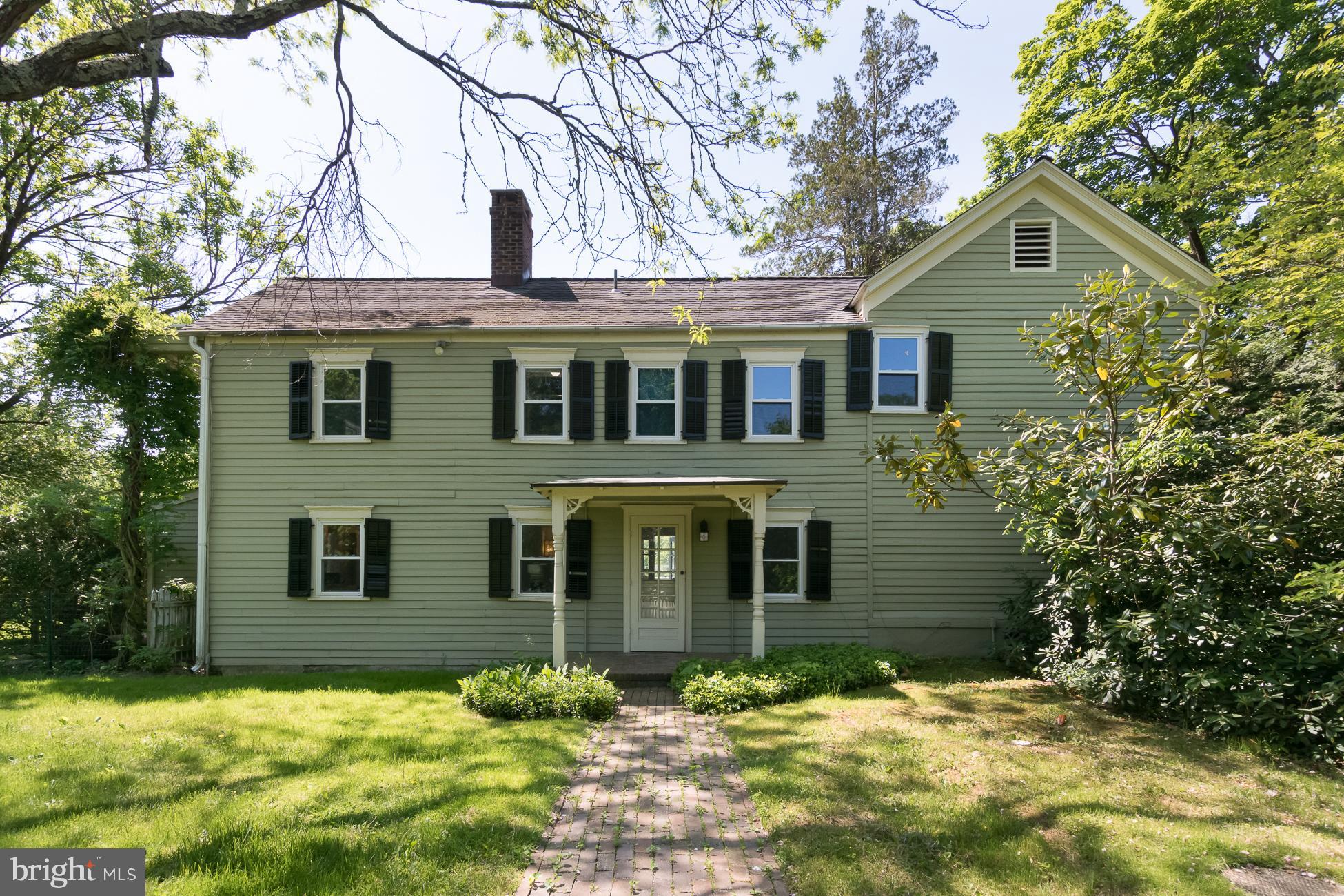 146 Carter Road Princeton, NJ 08540 - Photo 4 of 39 a front view of a house with a yard