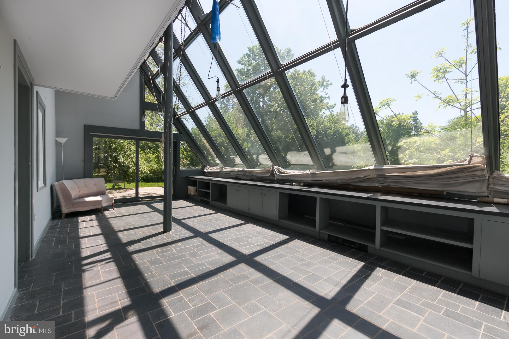 146 Carter Road Princeton, NJ 08540 - Photo 6 of 39 a view of a balcony with chairs and wooden floor