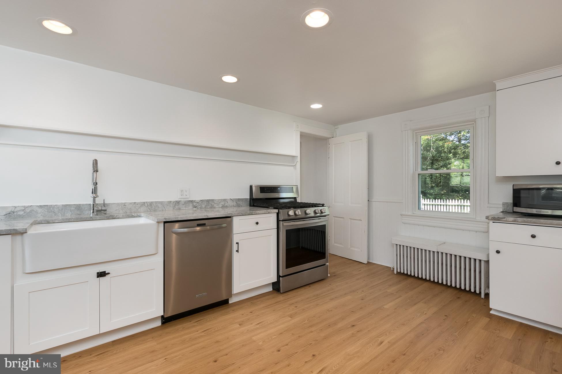 146 Carter Road Princeton, NJ 08540 - Photo 8 of 39 a kitchen with a sink stove top oven and cabinets