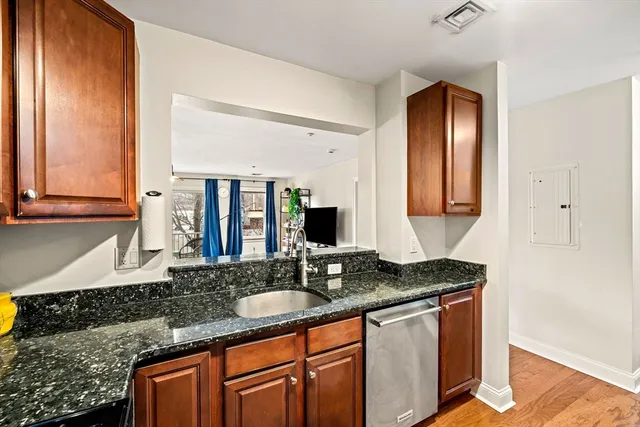a kitchen with granite countertop a sink and a granite counter tops