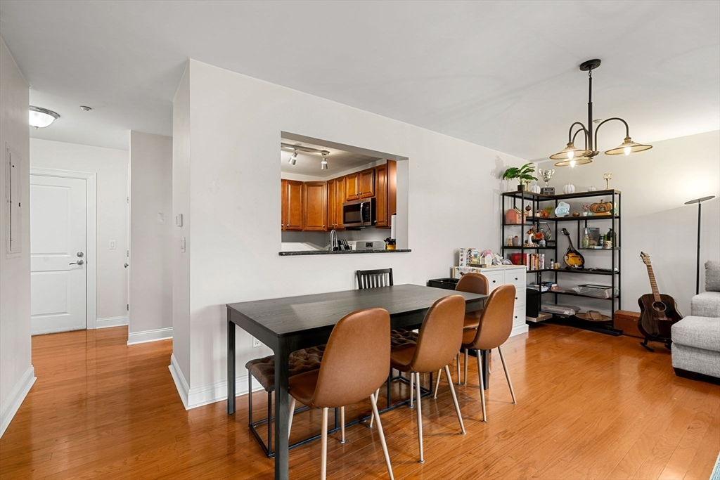 11 Cheriton Road, Unit 102 Boston, MA 02132 - Photo 18 of 42 a view of a dining room with furniture