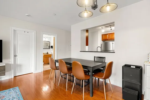 a view of a dining room with furniture and wooden floor