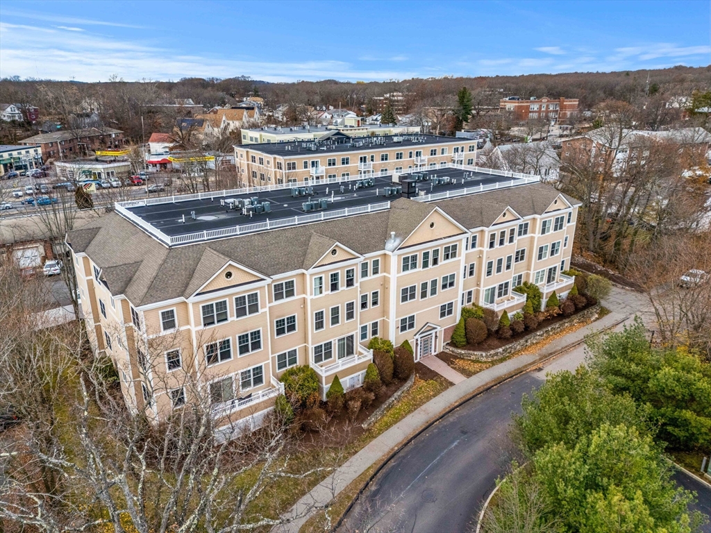 11 Cheriton Road, Unit 102 Boston, MA 02132 - Photo 2 of 42 a view of a city with tall buildings