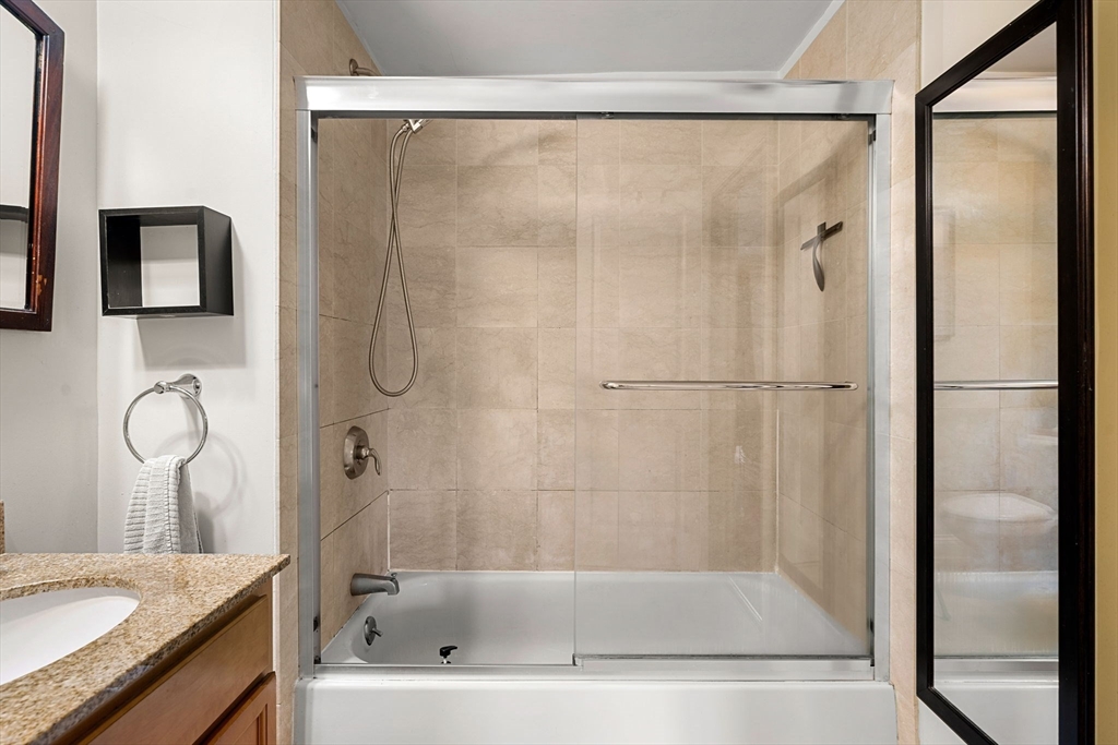 11 Cheriton Road, Unit 102 Boston, MA 02132 - Photo 23 of 42 a bathroom with a bathtub and a shower