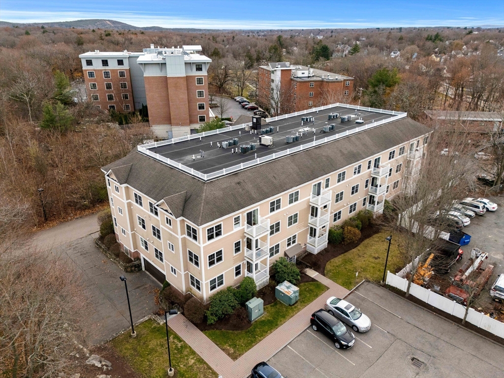 11 Cheriton Road, Unit 102 Boston, MA 02132 - Photo 3 of 42 an aerial view of a house with a yard