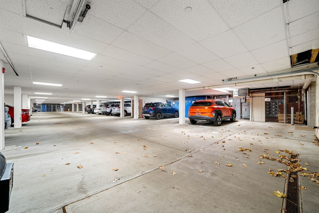 11 Cheriton Road, Unit 102 Boston, MA 02132 - Photo 32 of 42 a living room with furniture and a flat screen tv