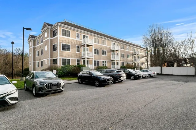 a car parked in front of a white house