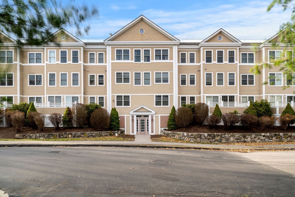 11 Cheriton Road, Unit 102 Boston, MA 02132 - Photo 8 of 42 a front view of a house with a yard
