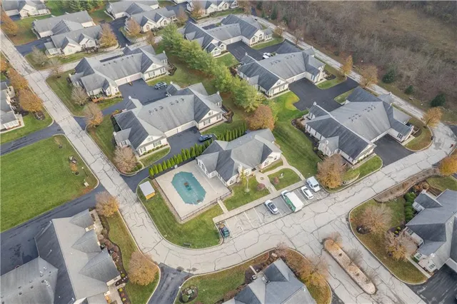 an aerial view of residential house with outdoor space and parking