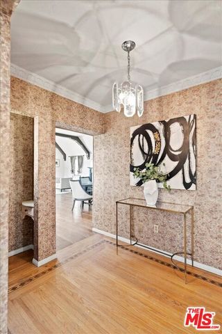 a view of a livingroom with furniture and chandelier