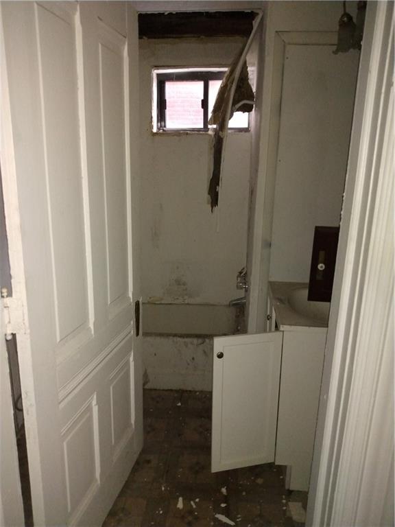 1005 Sheffield Street Pittsburgh, PA 15233 - Photo 11 of 25 a bathroom with a sink and mirror