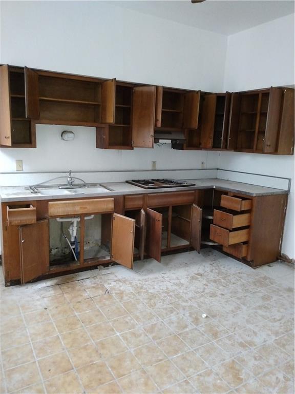 1005 Sheffield Street Pittsburgh, PA 15233 - Photo 15 of 25 a kitchen with stainless steel appliances a sink and a stove