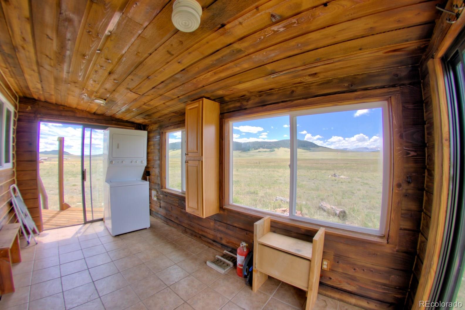 745 Bar D Road, Unit D Fairplay, CO 80440 - Photo 9 of 25 a living room with furniture and large windows