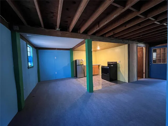 a bathroom with a sink mirror and shower